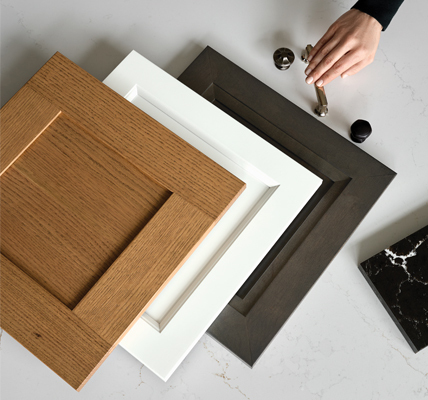 A wall of KraftMaid door style and finish samples